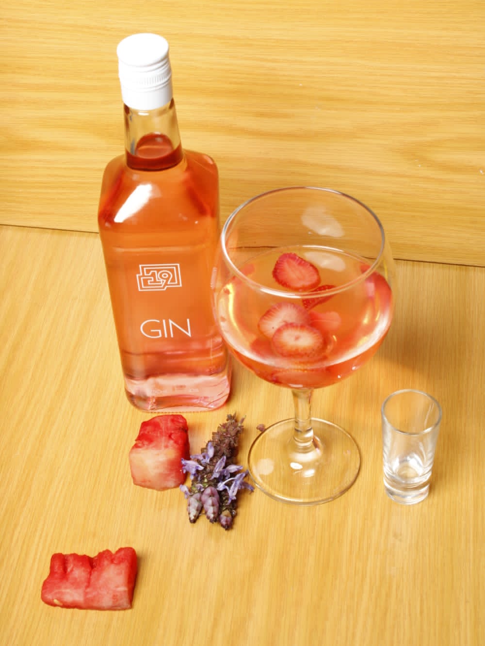 19 Blush Pink Gin bottle with vibrant pink hue and fruity flavor.