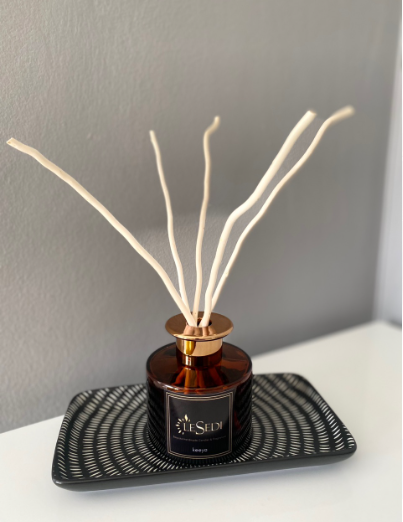 Arum Amber Reed Room Diffuser with natural reed sticks and amber bottle
