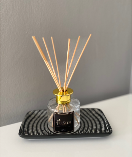 Arum Clear Room Reed Diffuser with reed sticks and clear bottle design