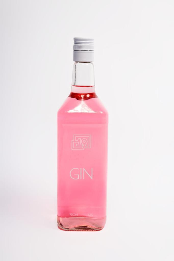 19 Blush Pink Gin served with fresh berries and a cocktail garnish.